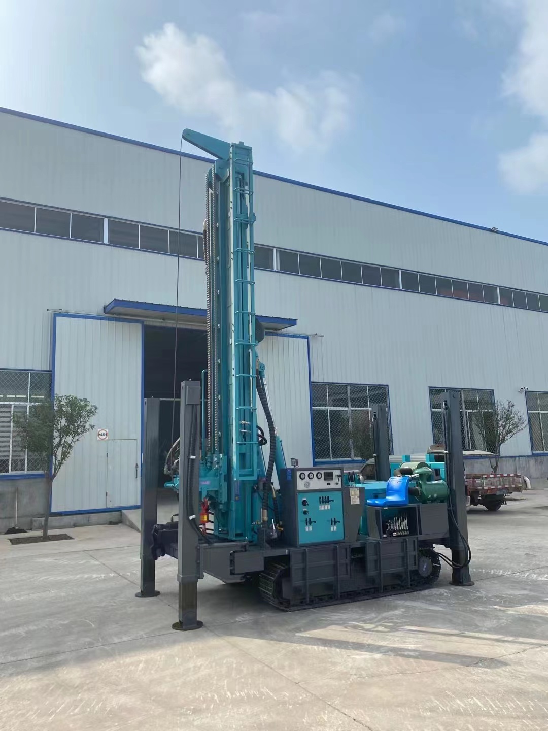 Water well drilling rig working on site